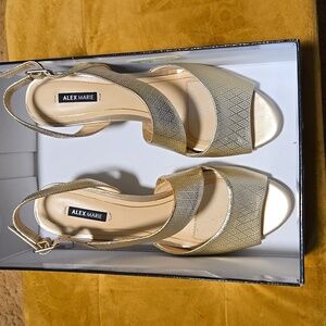 Alex Marie, beautiful gold cross strap sandals with wedge heel.